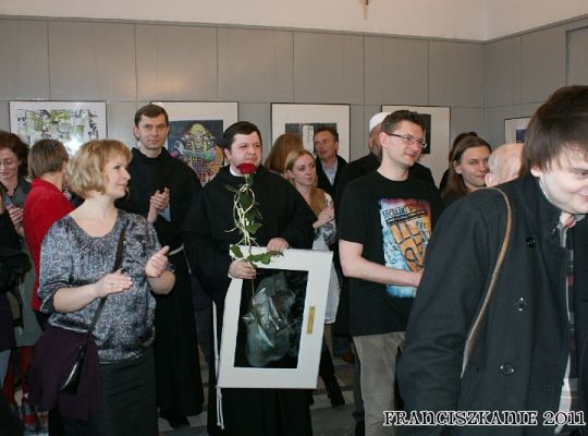 Grafika #6: DMK: Nagroda dla o. Romana